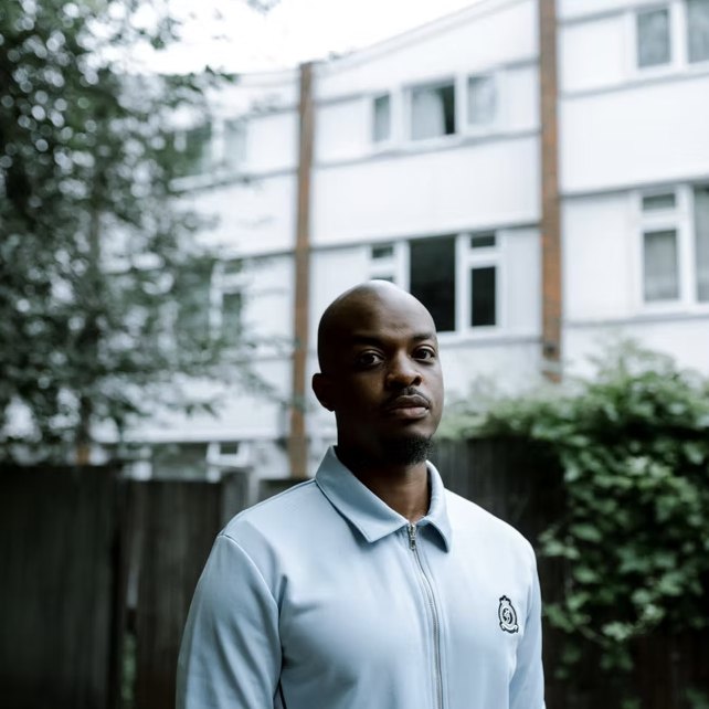 George the Poet standing outside his childhood home