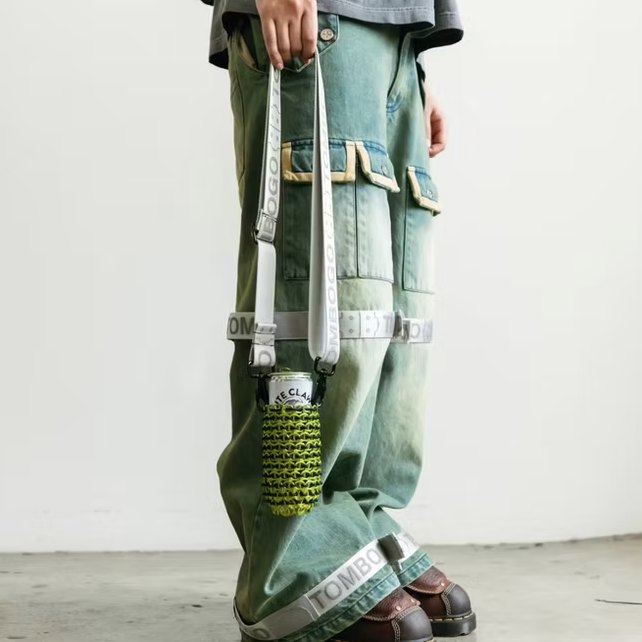 Tombogo trousers with a White Claw can holder on the strap